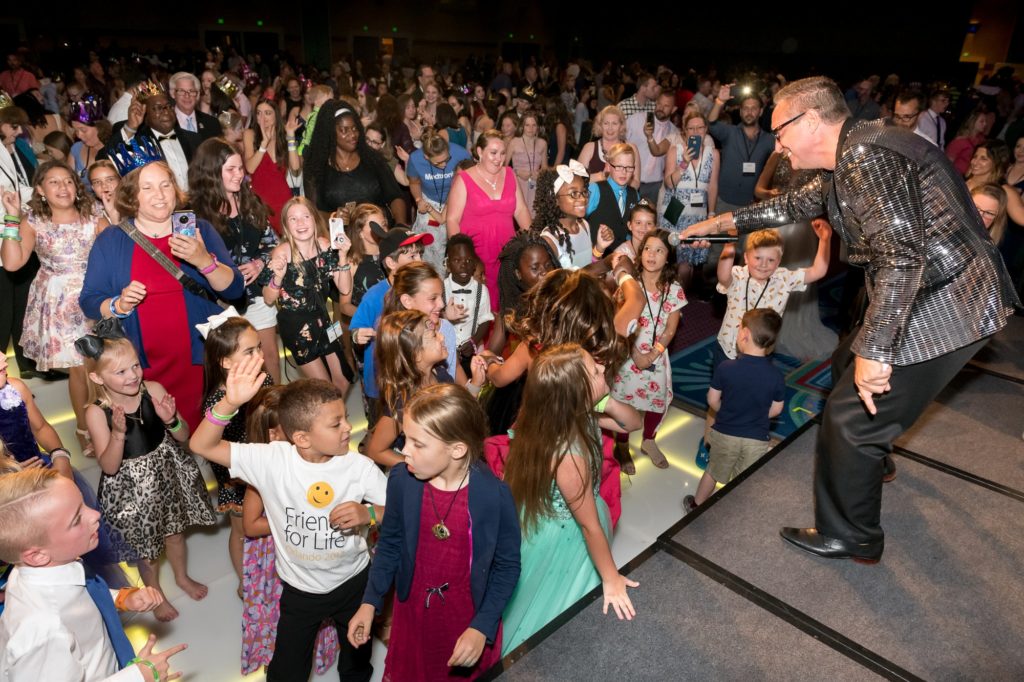 DJ Miles involves the kids during the dance