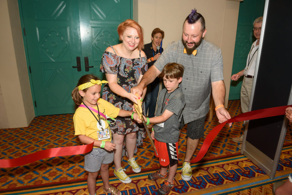 Amanda Jo and Billy Lee helped Isabella and Jackson cut the ribbon to open the Exhibition Hall on Wednesday